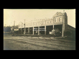 Parkersburg car barn and office of division superintendent. Brick street.