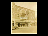 Monongahela Power's Light, Power, and Appliance Store at Parkersburg. Sign for La Mona Beauty Shoppe at left. Automobile. "Davies 35" written on photograph.