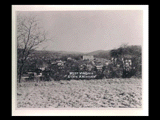 View of Mount de Chantal pasture land before construction of Wheeling College (Wheeling Jesuit). View of houses and other buildings, including Steenrod Grade School, in the distance.