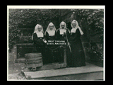 Four Sisters of the Visitation at the water pump of well at Mount de Chantal Visitation Academy in Wheeling. Sisters M. (Mary?) Anatasia, M. Catherine, M. Martha, and M. Ignatius.