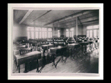 Old study hall at Mount de Chantal Visitation Academy in Wheeling with rows of desks.