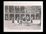 Group of students at the well in the yard of Mount de Chantal Visitation Academy in Wheeling.