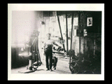 Lee Purpura standing in his machine shop.