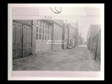 Alley in Wheeling between 16th and 17th streets. Exterior of Lee Purpura's machine shop.