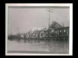 Scene on Wheeling Island during 1913 flood. View of houses.