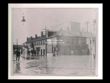 View of John Klari Drug Store building at the corner of 16th and Market streets during Wheeling flood.