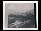 Stereoptican view of buildings, floodwall.