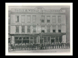 View of the <i>Wheeling Intelligencer</i> building and staff standing in front.