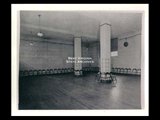 Interior view of Ohio Valley Hospital showing a recreation room in the nurses residence with metal folding chairs lining the walls.
