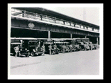 B&O Railroad station in Wheeling showing Railway Express Agency in its last days. Men standing at express trucks.