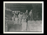 Interior view of LaBelle Iron Works and employees. Barrels.
