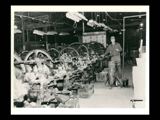 Interior view of Wheeling Steel with worker.