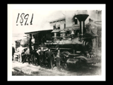 Wheeling and Lake Erie steam locomotive No. 8 with men standing alongside. Dog standing at front.