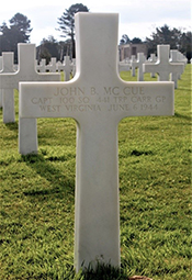 Cross marking the grave of Capt. John McCue in the Normandy American Cemetery. <i>Find A Grave</i> photo used with permission