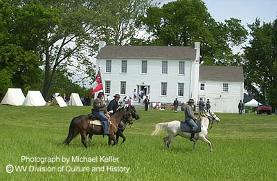 Civil War re-enactors on horseback