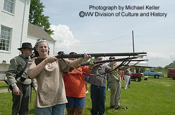 Visitors try their hand at firing weapons